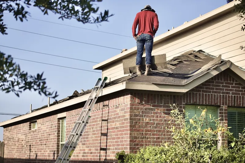 Professional roofer working on a residential roof in Lakeport